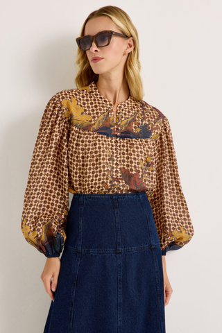 Yuko Denim Skirt in Dark Wash featuring a fitted high waist and softly flared A-line midi silhouette.