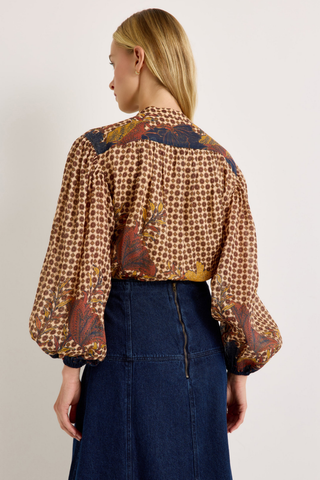 Yuko Denim Skirt in Dark Wash featuring a fitted high waist and softly flared A-line midi silhouette.
