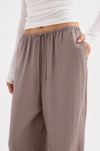 Taupe wide leg drawstring pants in a lightweight linen blend by Nude Lucy
