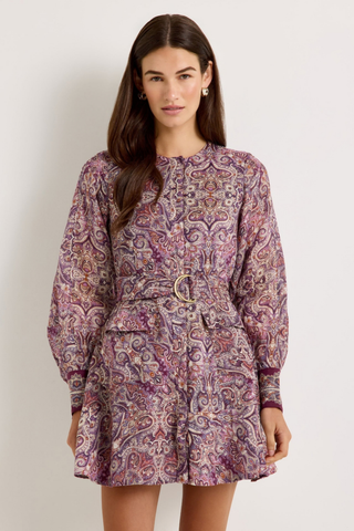 Marie Oliver Hughes Dress in Wisteria featuring a purple paisley print, long sleeves, patch pockets, and optional waist belt.