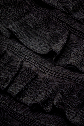 Hailey Dress in Caviar featuring a black mini silhouette with a high neckline, cap sleeves, and tiered ruffle detailing.