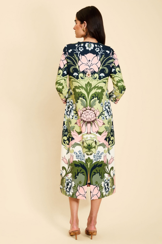 Mestiza Consuela Midi Dress in Eventide Gardens featuring a colorful botanical floral print, long sleeves, and a tailored midi silhouette.