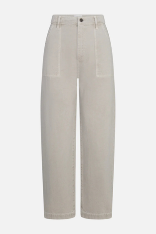 Model wearing FRAME The Bow Cargo in Flax, a high-rise barrel-leg cotton pant with oversized front cargo pockets in a neutral flax wash