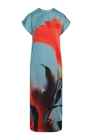 Model wearing the MISA Lenna Dress in Fire Petal featuring a high neckline, cap sleeves, abstract satin print, and elegant midi column silhouette.