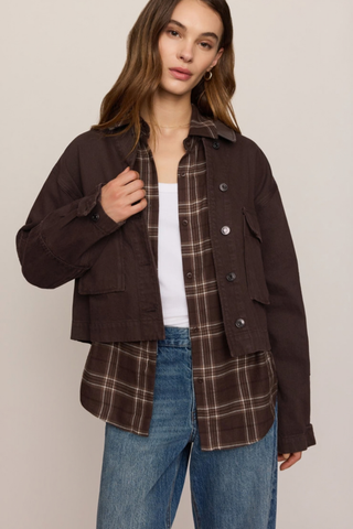 Z Supply Rey Cropped Chore Jacket in Umber featuring a brown cotton body, dark faux leather collar, button front, and utility pockets.