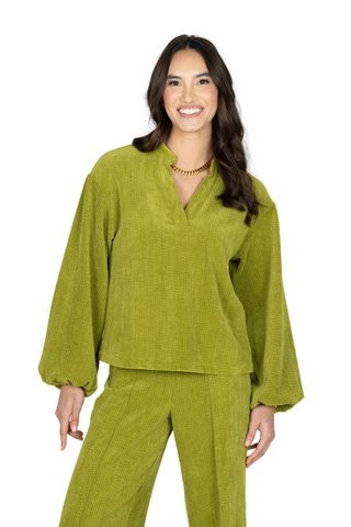 Emily McCarthy Lolli Top in Cardamom green featuring an open neckline, long voluminous sleeves, gathered cuffs, and relaxed fit.