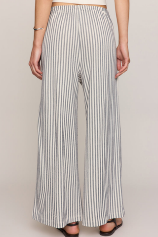 Model wearing the Z Supply Scout Knit Striped Pant in Eclipse featuring a high-rise waist, wide-leg silhouette, and striped knit fabric.