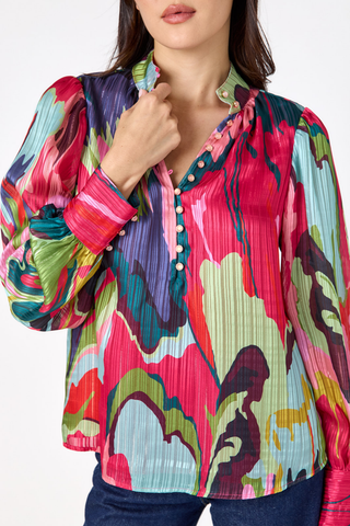 Crosby Leland Blouse in Life Of The Party featuring a colorful abstract print, collared neckline, button front, and long sleeves.