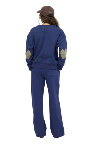 Kerri Rosenthal Ex-Boyfriend Sweatshirt in indigo blue featuring contrast heart elbow patches and a relaxed cotton fleece silhouette.