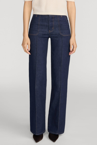 FRAME Le Slim Palazzo Pintuck Pocket jeans in dark Rinse wash with a high-rise waist, front patch pockets, pintuck seams, and wide-leg silhouette.