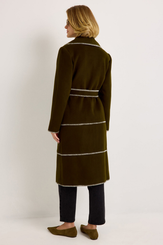 Chloe Coat in Juniper Green featuring a long wool wrap silhouette, oversized shawl collar, contrast stitching, and self-tie belt.