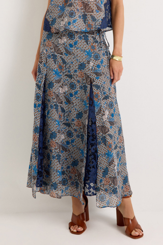 Gracen Skirt in Aegean featuring a blue and brown printed maxi silhouette with lace panel detailing and a flowing hem.