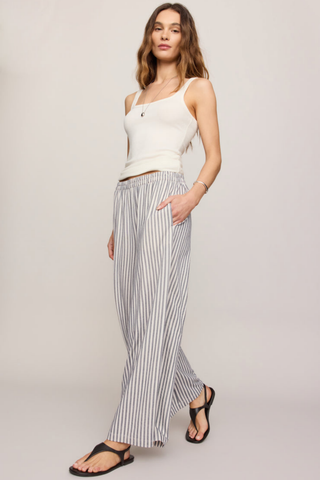 Model wearing the Z Supply Scout Knit Striped Pant in Eclipse featuring a high-rise waist, wide-leg silhouette, and striped knit fabric.