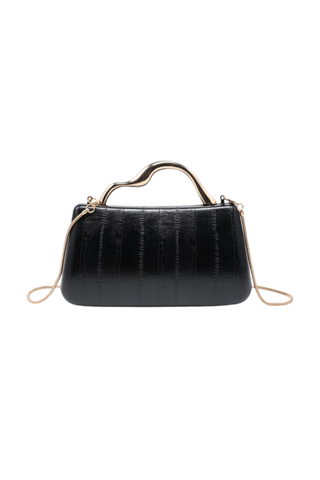 Rue Aveline Nichelle Clutch in Black featuring a textured structured exterior, sculptural gold-tone top handle, and removable chain strap.