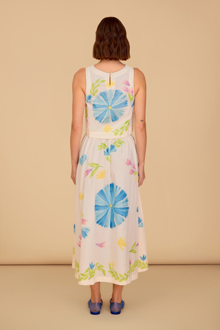 Sleeveless floral crop top with blue and pink painted print paired with matching midi skirt