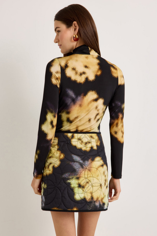 Marie Oliver Eloise Top in Lush featuring a black and yellow abstract floral print, fitted long sleeves, and sleek turtleneck silhouette.