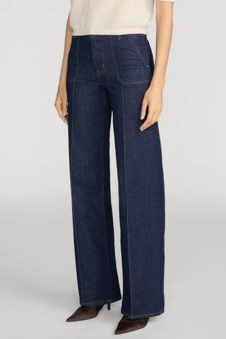 FRAME Le Slim Palazzo Pintuck Pocket jeans in dark Rinse wash with a high-rise waist, front patch pockets, pintuck seams, and wide-leg silhouette.
