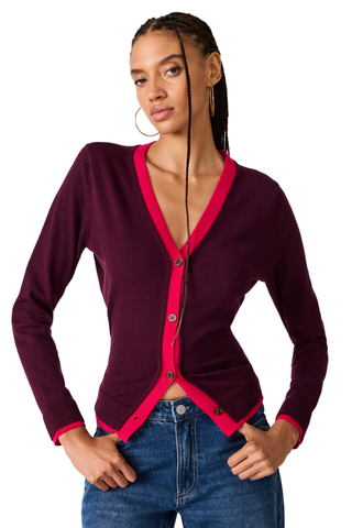 Deep fig fitted cardigan with contrast pink trim and button-front closure.