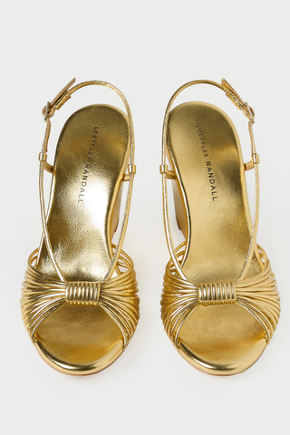 Loeffler Randall Marren Wedge in gold metallic leather featuring knotted mignon toe straps, slingback strap, open toe, and 3.5-inch wedge heel