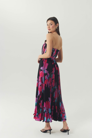 Hutch Merrick Dress in black and pink featuring a strapless bodice, vibrant floral print, and flowing maxi skirt.