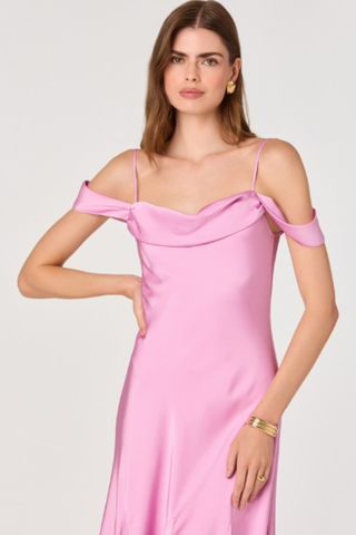 Woman wearing a pink off-the-shoulder midi dress with draped neckline and flowy skirt from ASTR on a white background.