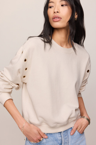 Z Supply Axel Grommet Sweatshirt in Sandstone featuring gold grommet detailing and soft French terry fabric.