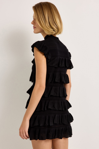 Hailey Dress in Caviar featuring a black mini silhouette with a high neckline, cap sleeves, and tiered ruffle detailing.