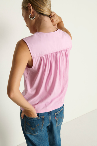 Model wearing the Nation LTD Selma V-Neck Tank in Lilac featuring a relaxed silhouette, flattering V-neckline, and lightweight slub Pima cotton knit.