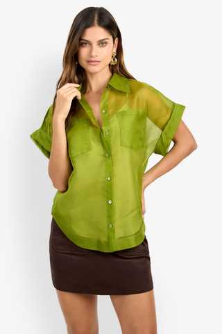 Trina Turk Costanzo Top in Dark Fennel featuring sheer green silk organza, short cuffed sleeves, a button front, and patch pockets.