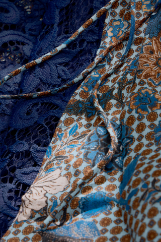 Gracen Skirt in Aegean featuring a blue and brown printed maxi silhouette with lace panel detailing and a flowing hem.