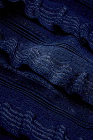 Adeline Top in Navy featuring a fitted mockneck silhouette with dimensional ruffle detailing across the body and long sleeves.
