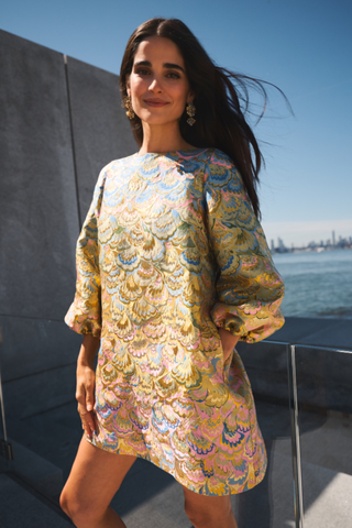 Mestiza Rosanna Mini Dress in Gilded Marble featuring a gold-toned jacquard pattern, A-line mini silhouette, and three-quarter balloon sleeves.