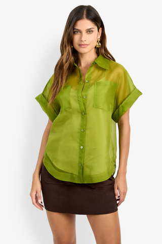 Trina Turk Costanzo Top in Dark Fennel featuring sheer green silk organza, short cuffed sleeves, a button front, and patch pockets.