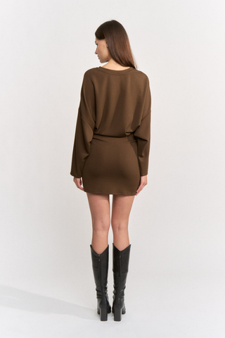 En Saison Jane Mini Dress in Brown featuring a long-sleeve jersey knit bodice, cinched waist, and fitted mini skirt.