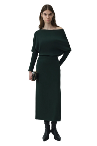 SIMKHAI Janese Off Shoulder Midi Dress in deep Everglade green with long sleeves, a fitted waist, and straight midi skirt.