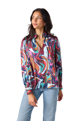 Crosby Lyla Blouse in Color Current featuring a vibrant multicolor print, collared neckline, button front, and long sleeves.
