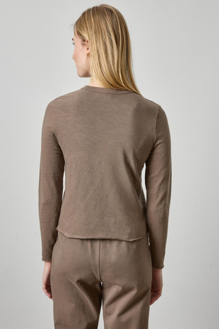 Woman wearing the Lilla P Vintage Bias Tee in Shiitake, a fitted taupe long-sleeve cotton tee.