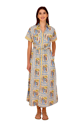 Blue and yellow printed midi dress with button front, short sleeves, and tie waist styled with flat sandals