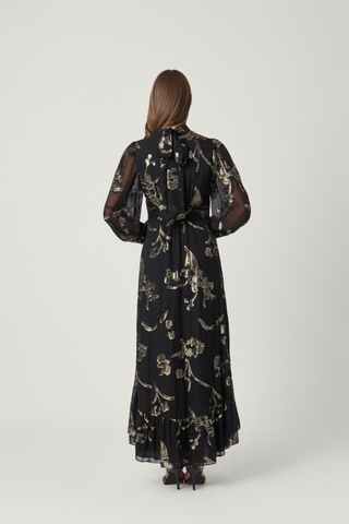 Shoshanna Langdon Dress in Jet/Gold featuring shimmering black and gold lurex chiffon, long balloon sleeves, and an asymmetrical tiered skirt.