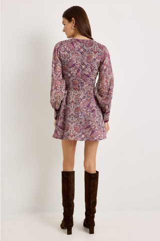Marie Oliver Hughes Dress in Wisteria featuring a purple paisley print, long sleeves, patch pockets, and optional waist belt.