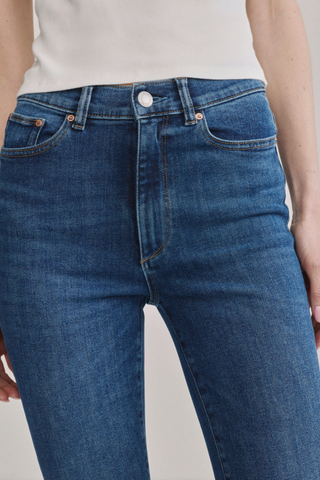 DL1961 Bridget Boot Jean in Night Diner featuring a high-rise bootcut fit, mid-blue wash, and subtle whisker detailing.