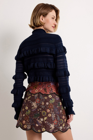 Adeline Top in Navy featuring a fitted mockneck silhouette with dimensional ruffle detailing across the body and long sleeves.
