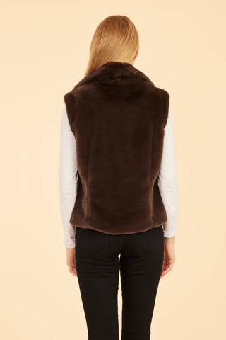Dolce Cabo Faux Fur Vest in Dark Brown featuring plush chocolate brown faux fur, a notch collar, open front, and side pockets.