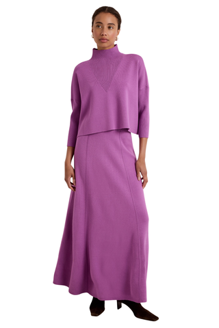 Jemma Skirt in Iris featuring a purple structured knit, fitted waistband, and fluid fit-and-flare silhouette.