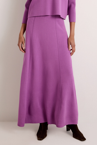 Jemma Skirt in Iris featuring a purple structured knit, fitted waistband, and fluid fit-and-flare silhouette.