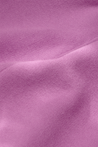 Jemma Skirt in Iris featuring a purple structured knit, fitted waistband, and fluid fit-and-flare silhouette.