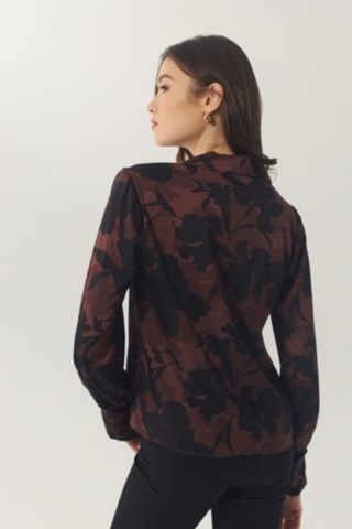 Hutch Cain Top in Brown and Black featuring an allover floral print, draped neckline, and relaxed long-sleeve silhouette.