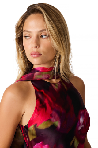 Steve Madden Jaiden Dress in Deco Rose featuring a pink and red floral satin print, halter scarf neckline, cutaway shoulders, and maxi silhouette.