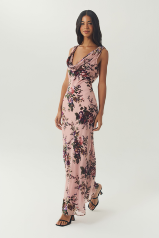 Blush floral sleeveless maxi dress with a flattering bias-cut silhouette.