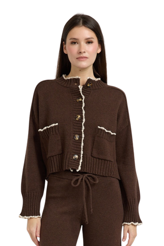 En Saison Victoria Cardigan in Brown featuring contrast edge stitching, a button-front closure, long sleeves, and a relaxed knit silhouette.
